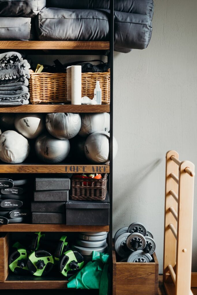 white ceramic vase on brown wooden shelf